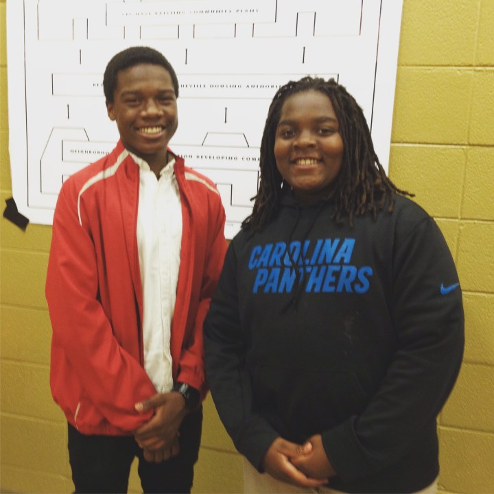 Hood Huggers Donovan and Dylan help with outreach at the Big Crafty. 